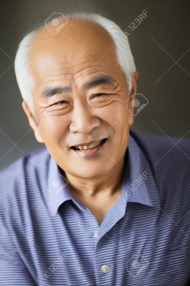 Senior Asian man at home