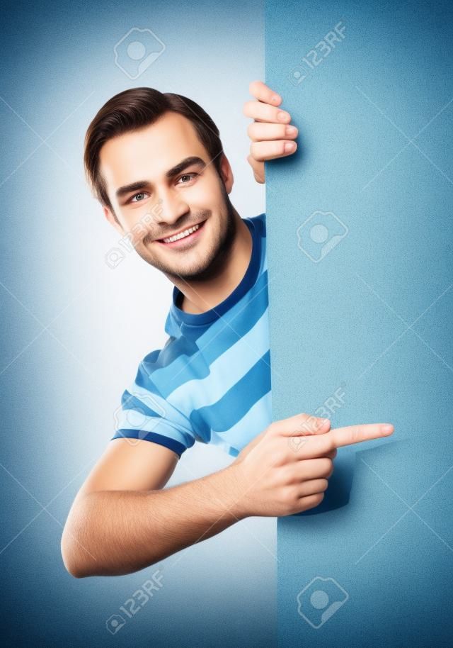 Handsome person pointing on blank signboard isolated against white background