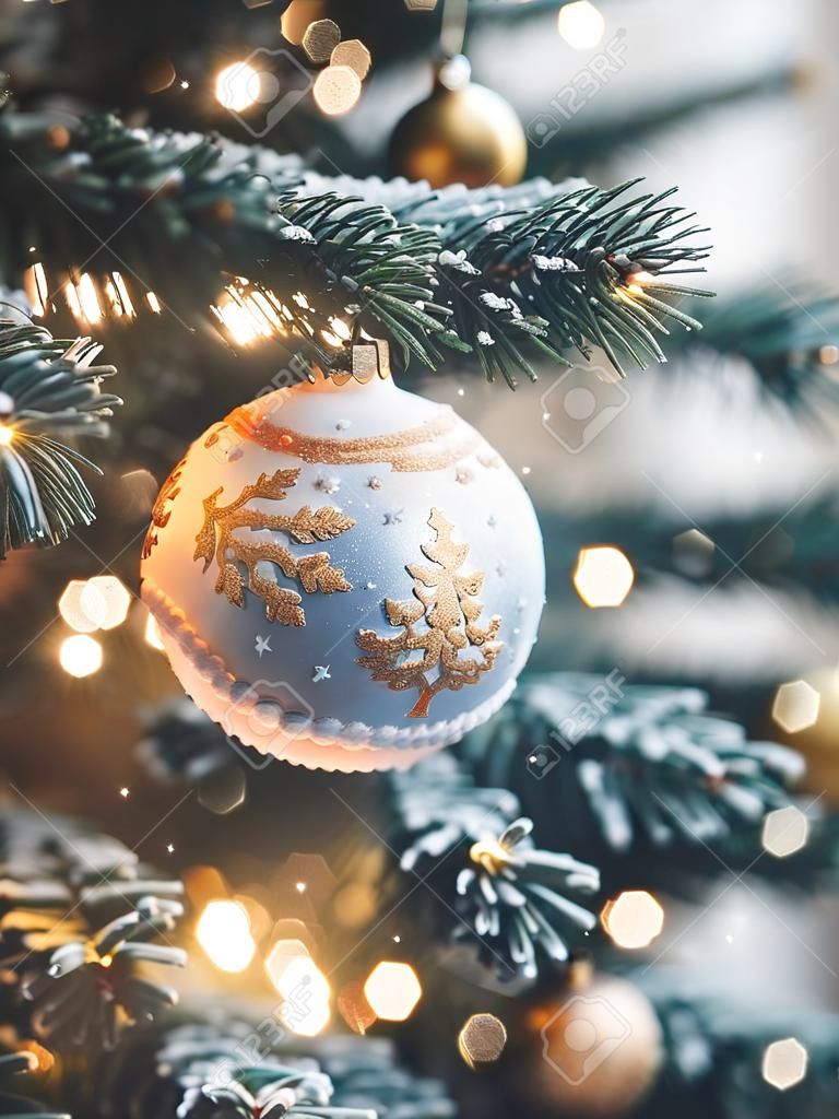 Christmas tree with decorations on blurred bokeh background. New Year.