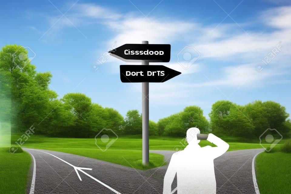 Rear businessman in front of crossroad and signpost arrows shows two different courses, left and right direction to choose. Road splits in distinct direction ways. Difficult decision, choice concept.
