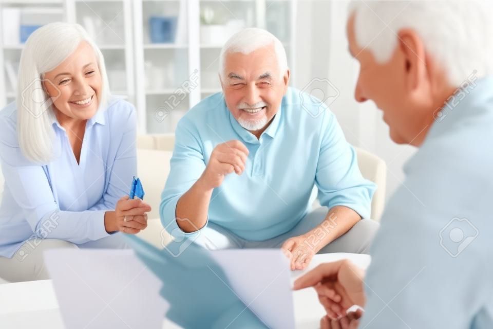 Senior couple getting advice on financing care and retirement from financial advisor