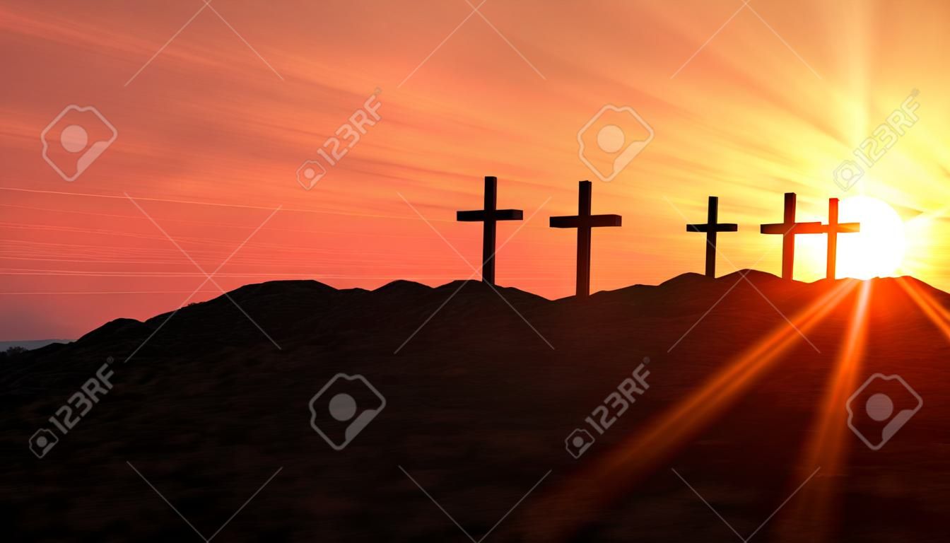 3 krzyże na wzgórzu na zachodzie słońca