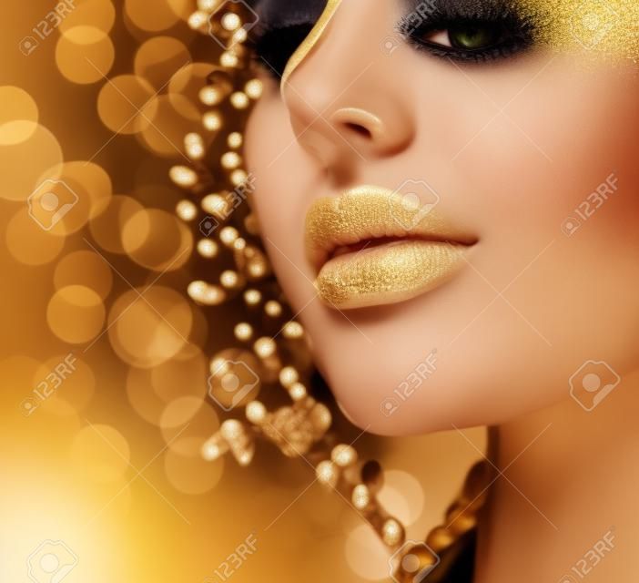Beauty model girl with golden skin. Fashion art portrait