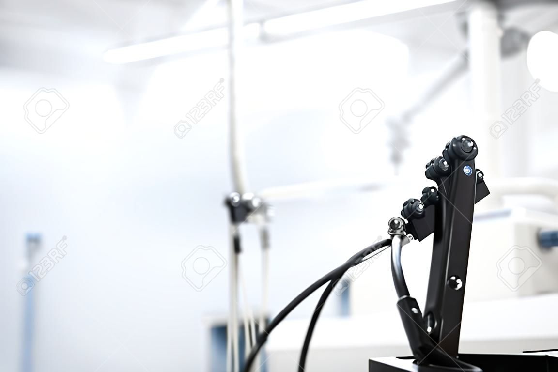 The bronchoscope is ready for operation and is located in a modern laboratory with a mass of equipment. Image with space for text.
