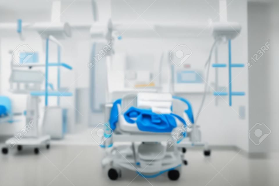 Patient bed in the tidy emergency room, defocused background.