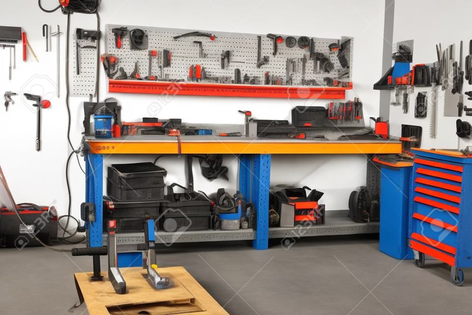 Garage, service zone for disassembling, repairing motorcycles, station for technical servicing vehicle Inside workshop with large workbench, large number of tools for machining.  wrenches on the wall