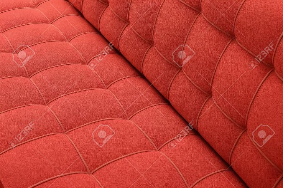 赤いカバーの柔らかい綿布の細かい縫製ソファのテクスチャの詳細。家具の背景の生地のパターン。
