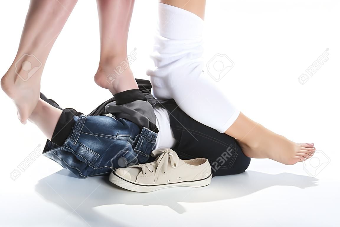 Young loving couple man and woman pants dropped down on their feet Romantic moment