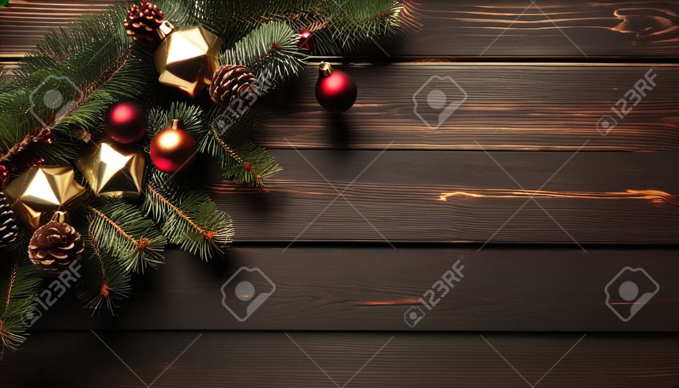 Christmas background with fir branch on wooden board.