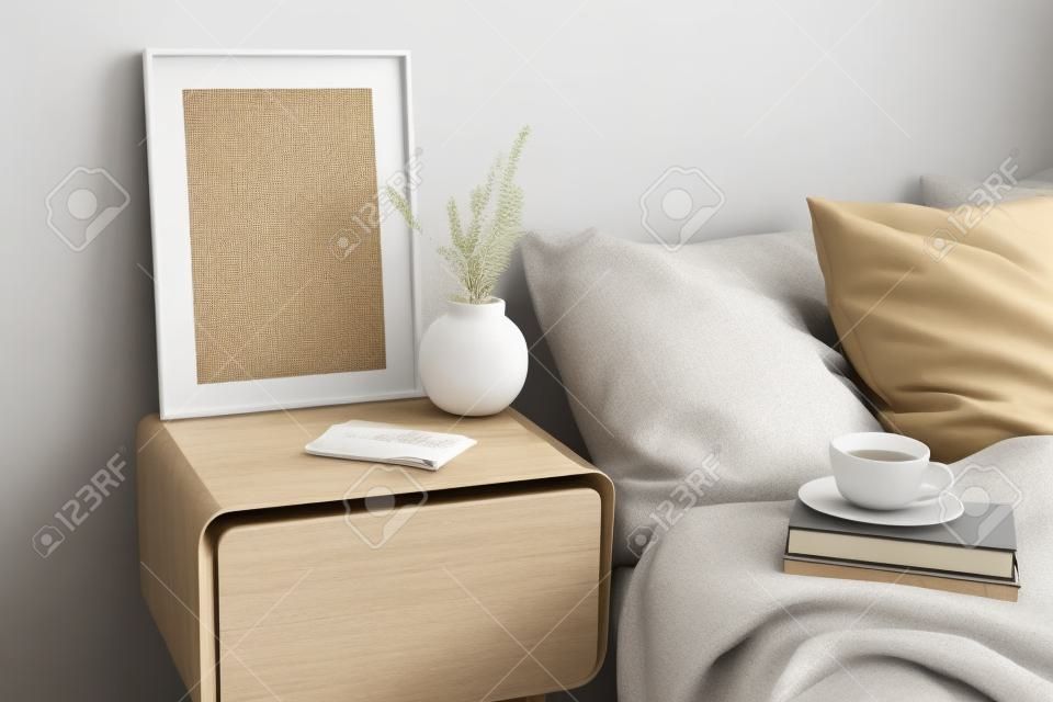Portrait white frame mockup on retro wooden bedside table. Modern white ceramic vase, dry Lagurus ovatus grass. Cup of coffee and books in bed. Beige linen pillows in bedroom. Scandinavian interior.