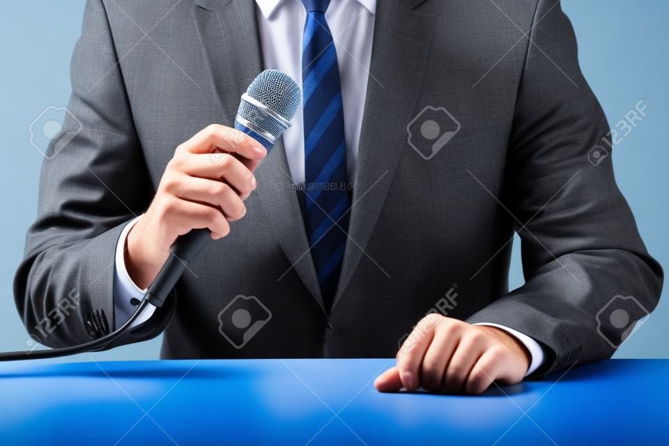 a businessman who uses a microphone