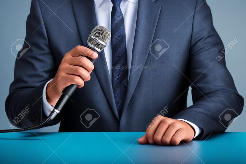 a businessman who uses a microphone