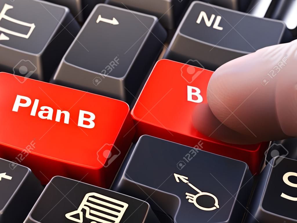 Plan B - Written on Red Keyboard Key. Male Hand Presses Button on Black PC Keyboard. Closeup View. Blurred Background. 3D Render.