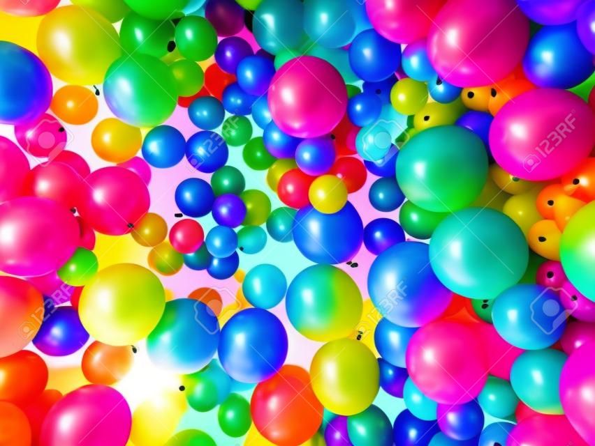 Jasne abstrakcyjne tło zbieraniny tęczowych kolorowych balonów świętujących.