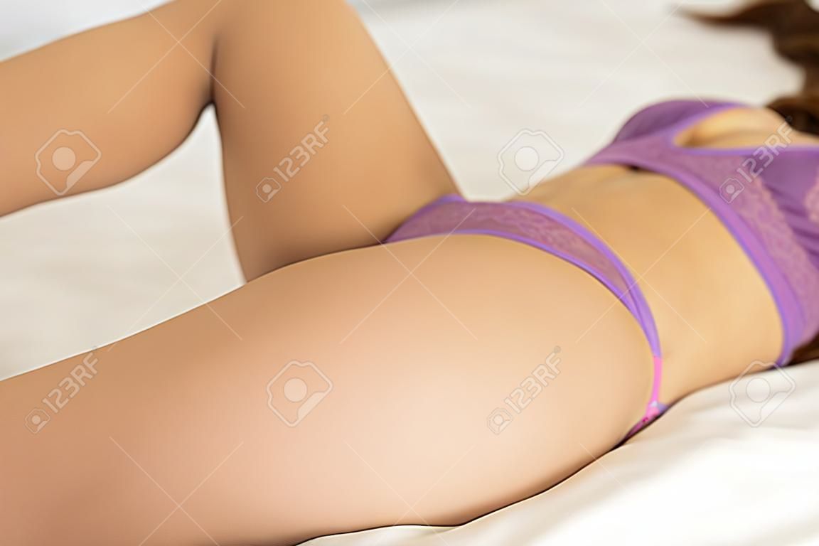 Beautiful woman body in bedroom background