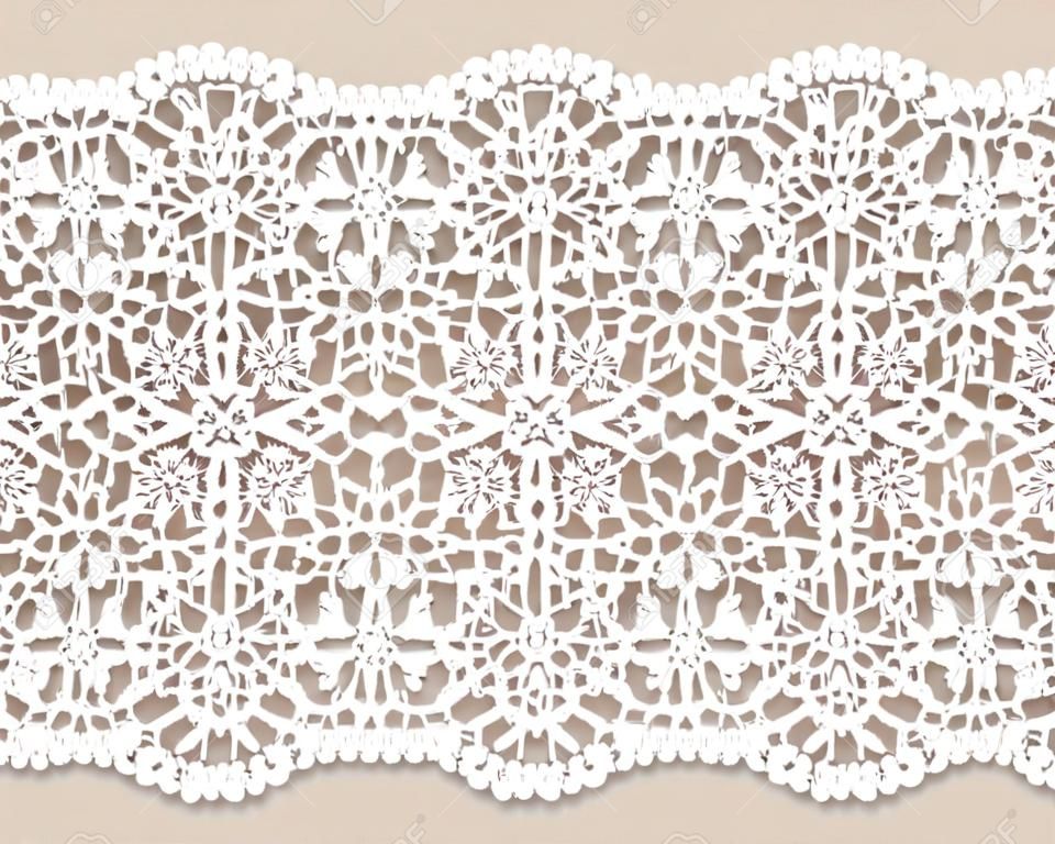 White lace doily with flowery pattern on a beige background