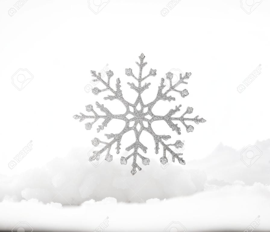 Christmas decoration. Christmas snowflake on snow