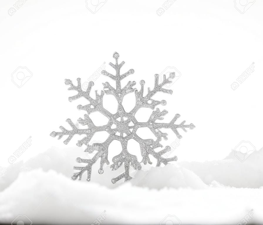 Christmas decoration. Christmas snowflake on snow