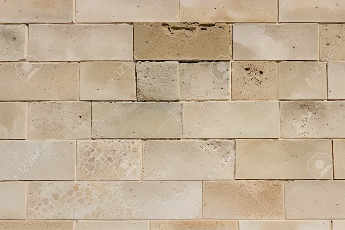 piedra textura de los azulejos en la pared exterior de una iglesia