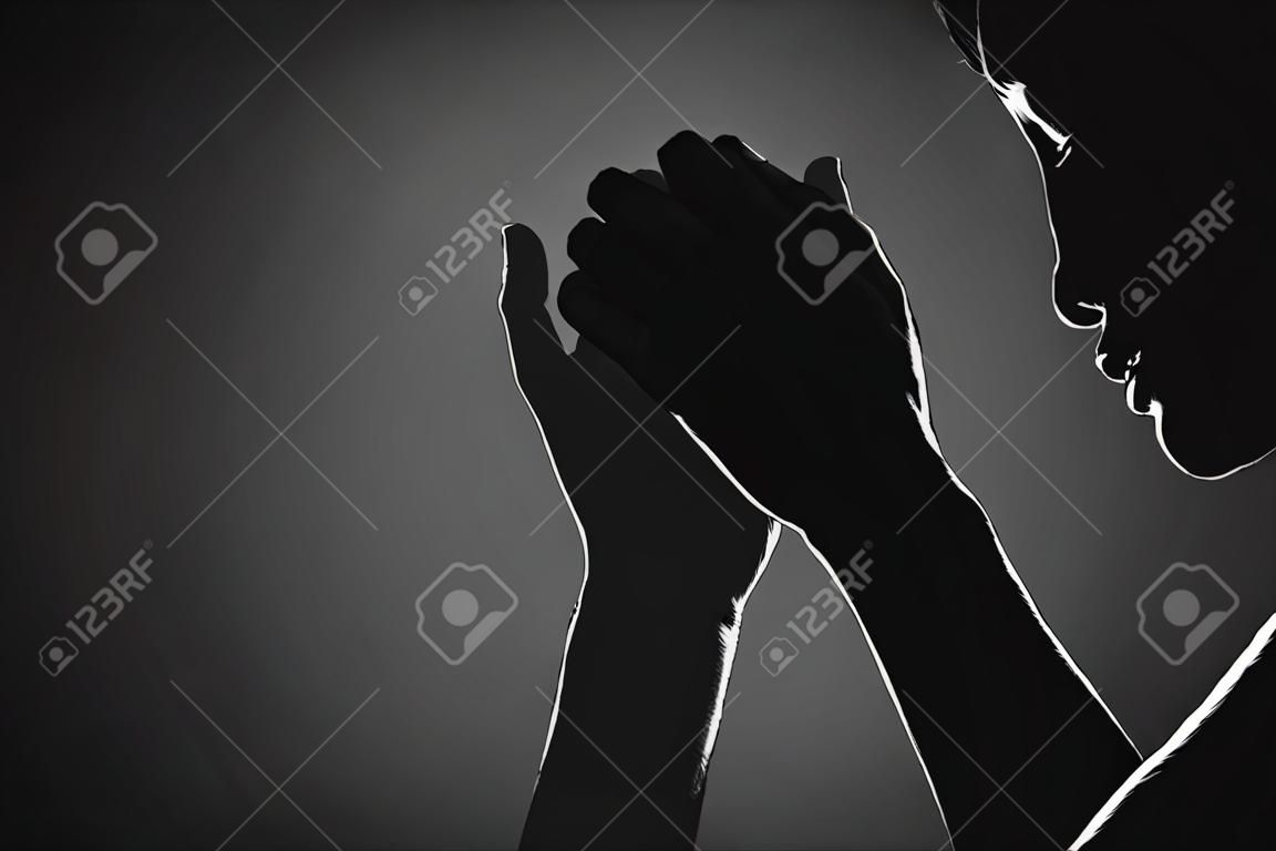 Religion, belief, worship concept copy space: Black and white prayer hands with palms up to pray God