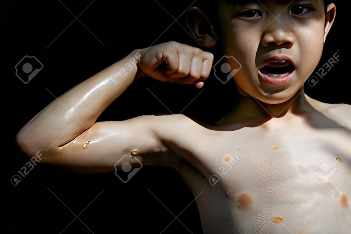 Close up on skin body muscle and sweat drop on young strong Asian boy body after heavy excercise