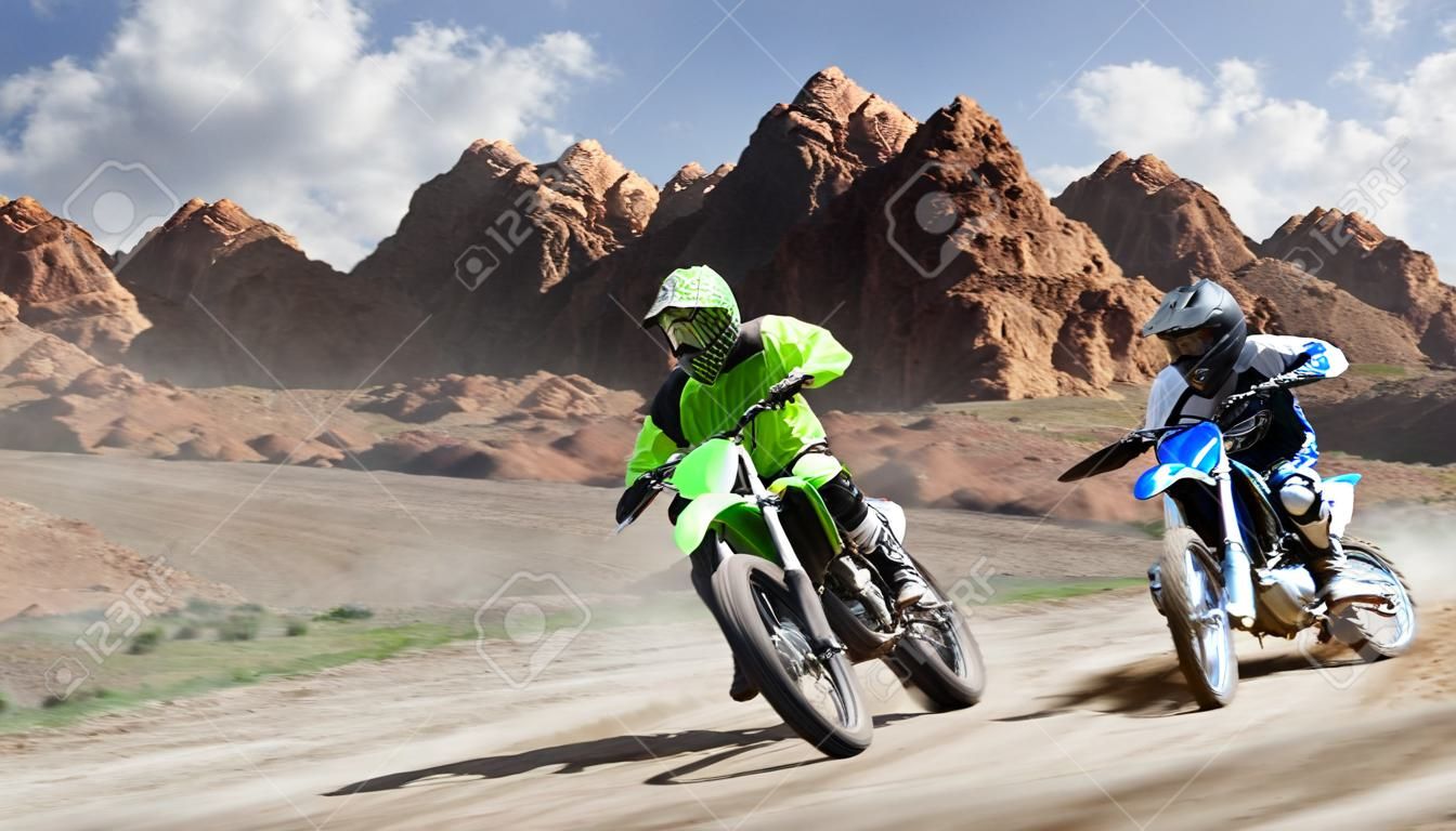 Brave professional dirt bike riders racing on the track