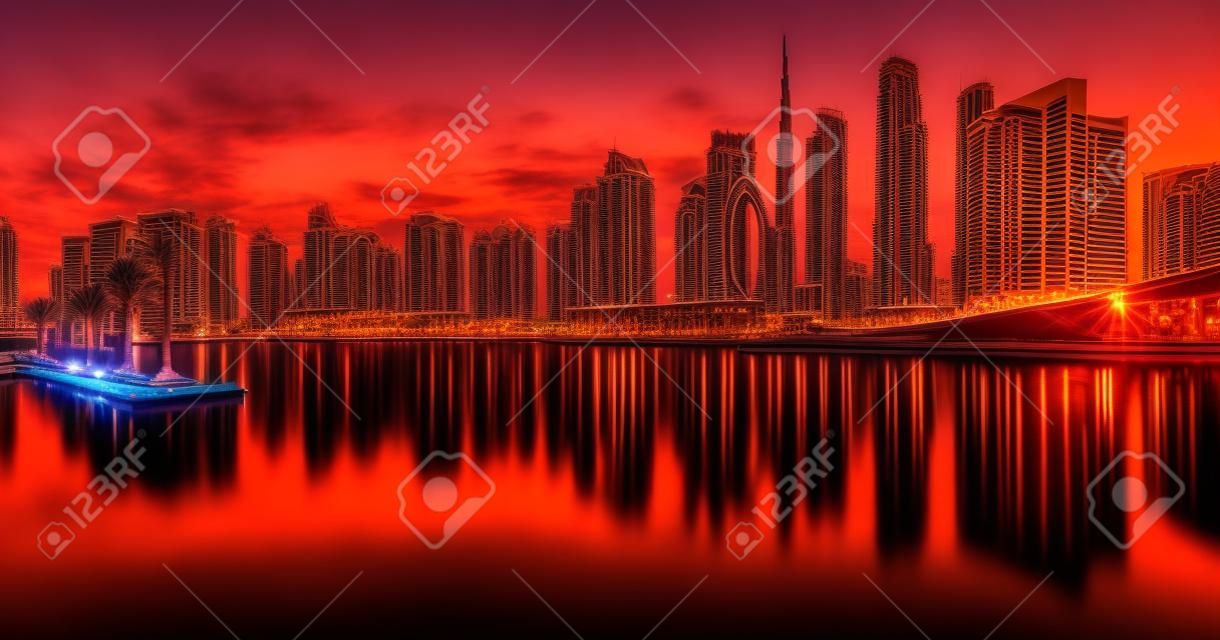 Dubai skyline with reflection at dramatic sunset,  UAE