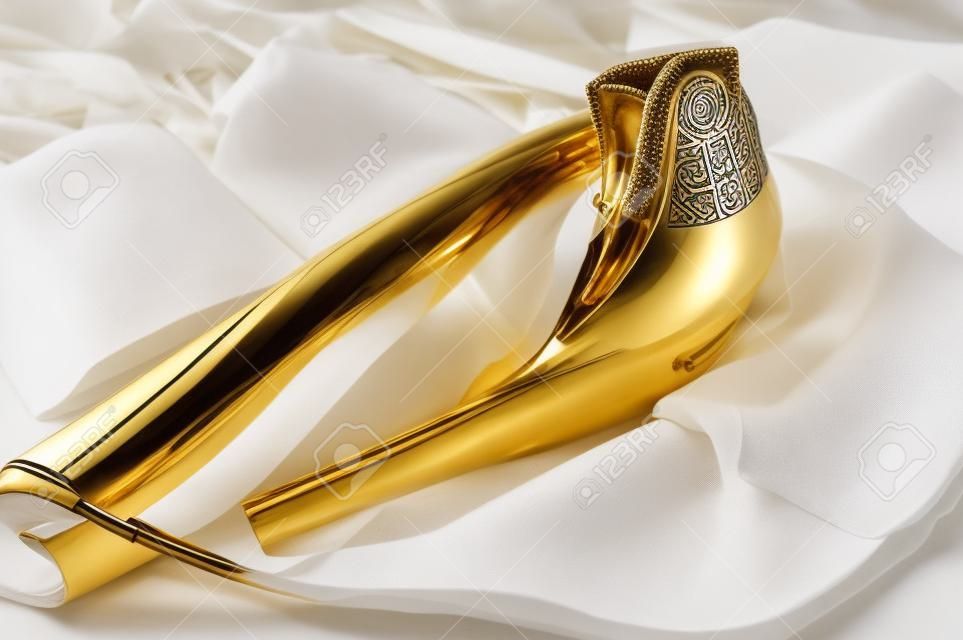 shofar horn on white prayer talit. room for text. rosh hashanah jewish holiday concept . traditional holiday symbol.