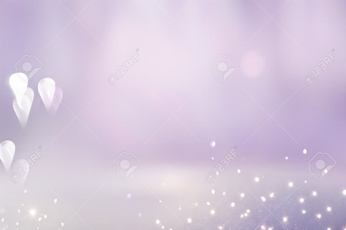 Luces abstractas del bokeh del rosa, de la luz púrpura y de la plata. Fondo desenfocado