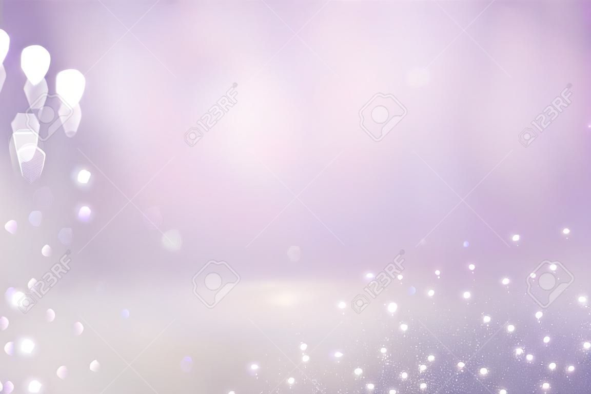 Luces abstractas del bokeh del rosa, de la luz púrpura y de la plata. Fondo desenfocado