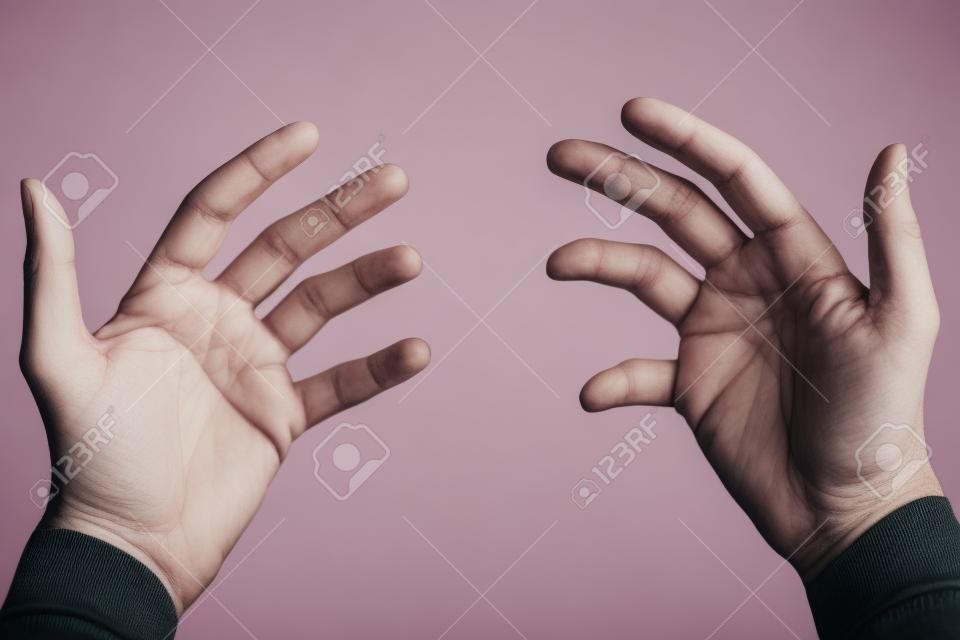 Empty hands held out viewed from first person perspective isolated on white.