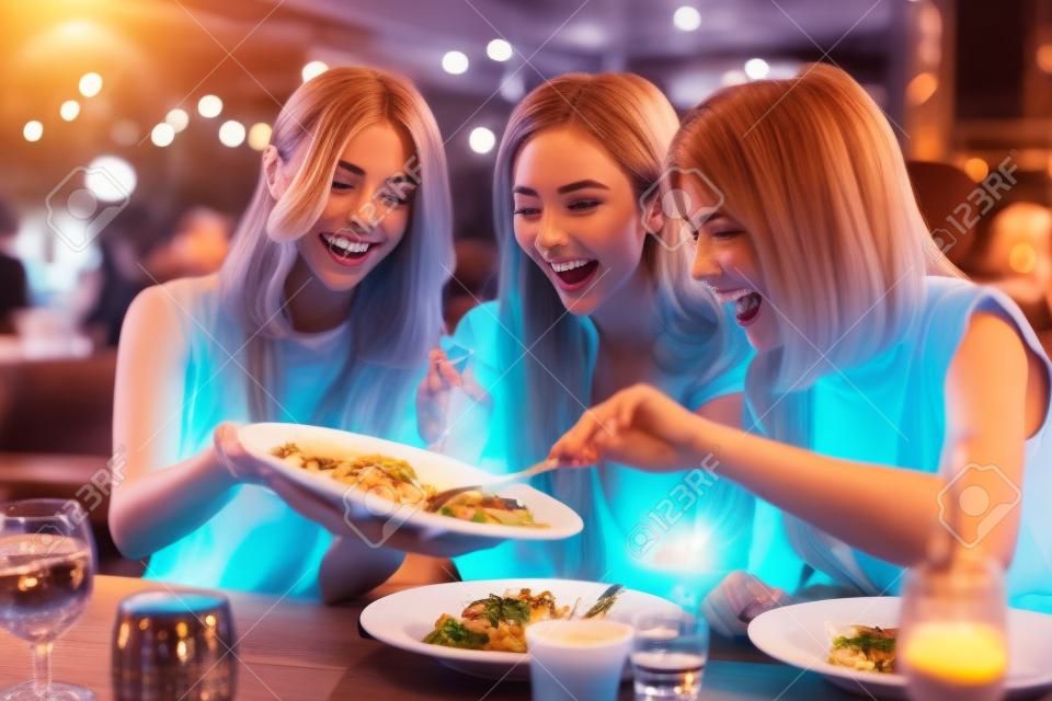Group of Happy friends having dinner in the restaurant