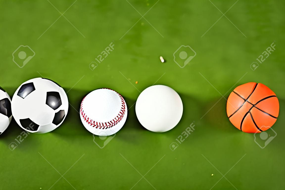 Four balls on green grass