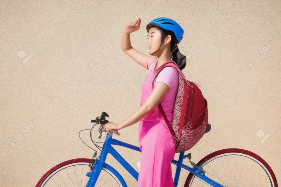 Beautiful asian woman She is cycling in the sun.