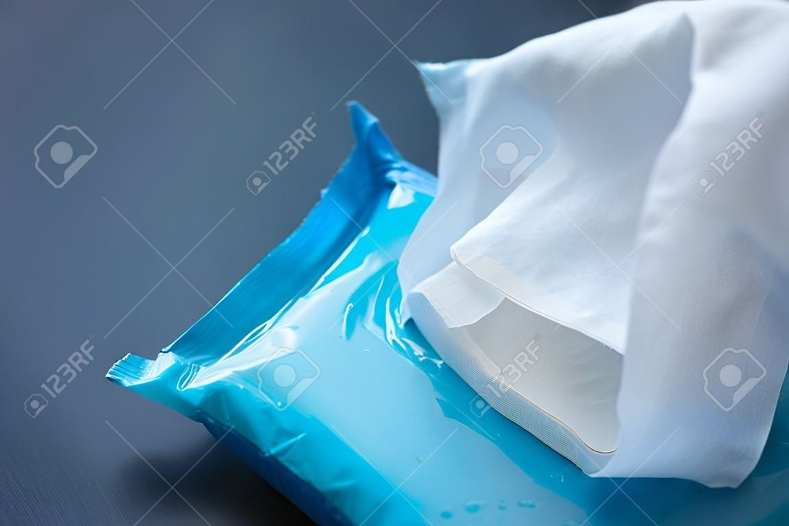 Cleansing wet wipes on table with copy space