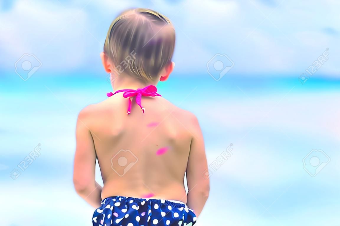 Close up heart painted by sun cream on kid shoulder