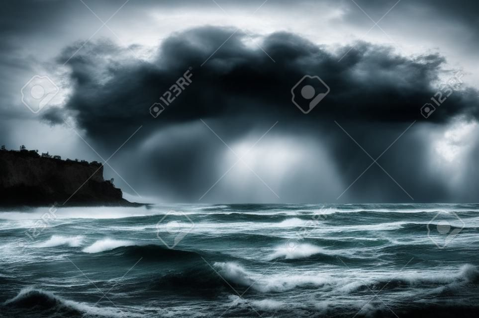 Scary stormy clouds on coastline seaside. Dark water waving. Nature, weather forecasting problems and danger concept.