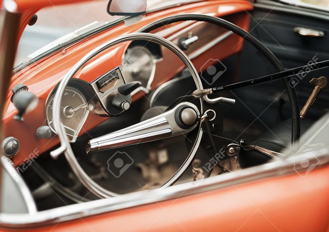 retro car with a beautiful design, the steering wheel is closed with an old lock on a chain