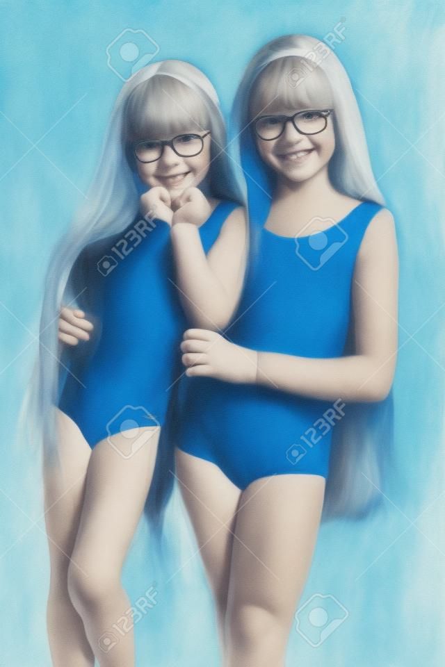 portrait of happy girls in a sports gymnastic swimsuit