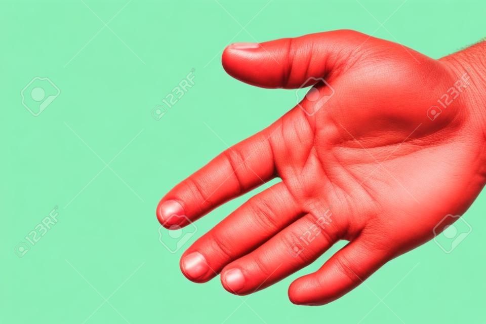 Closeup view of index finger on right human hand turned with palm is cut hurt and bleeding with bright red blood outdoor sunny day on blured green background, horizontal picture