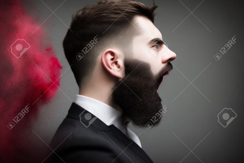 Hipster shout with bloody beard on brutal face profile