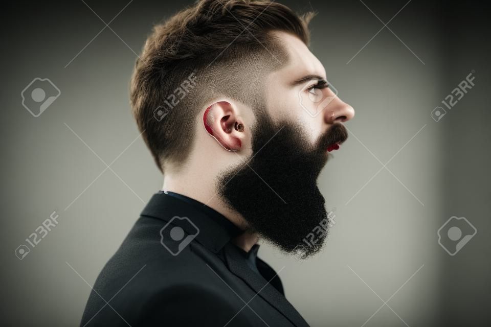 Hipster shout with bloody beard on brutal face profile