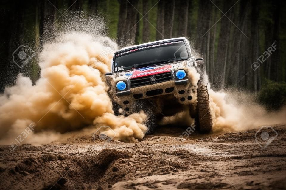 Off-road vehicle goes on the mountain. Mud and water splash in off-road racing. Drag racing car burns rubber. Extreme. Off-road car. Best Off Road Vehicles. Rally racing.