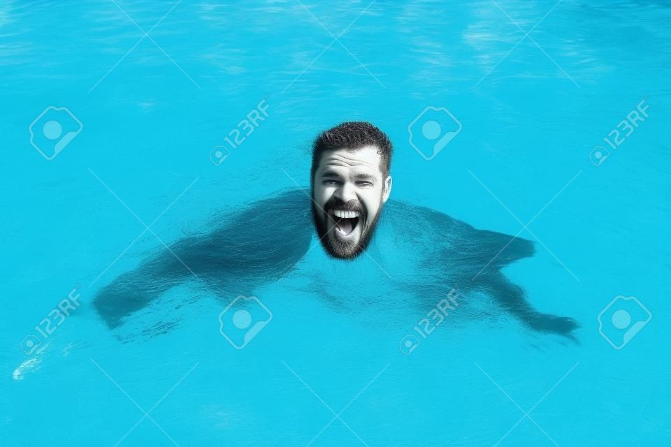 Businessman swimming in suit in the pool. Funny and crazy man in swimming Pool. Business Man having fun by the Pool.