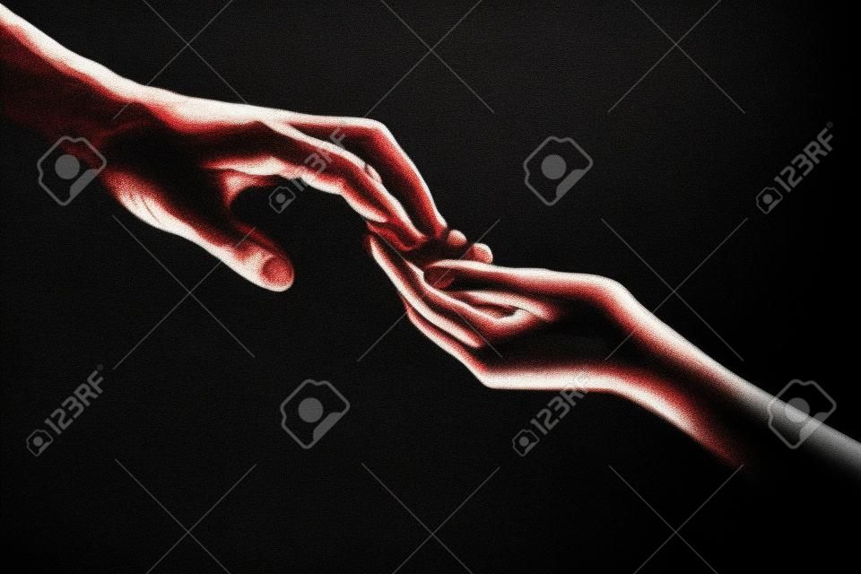 Twee handen. helpende hand voor een vriend. redding of helpend gebaar van handen. concept van verlossing. handen van twee mensen op het moment van redding, help. geïsoleerd op zwarte achtergrond. tederheid, neiging tot aanraking.