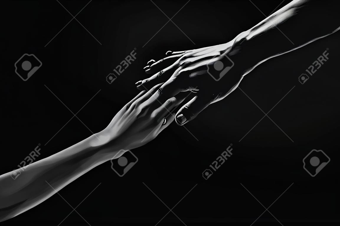 Two hands at the moment of farewell. The holding hands of relations. Help friend through a tough time. Rescue gesture, support, friendship and salvation concept. Man and woman holding hands.