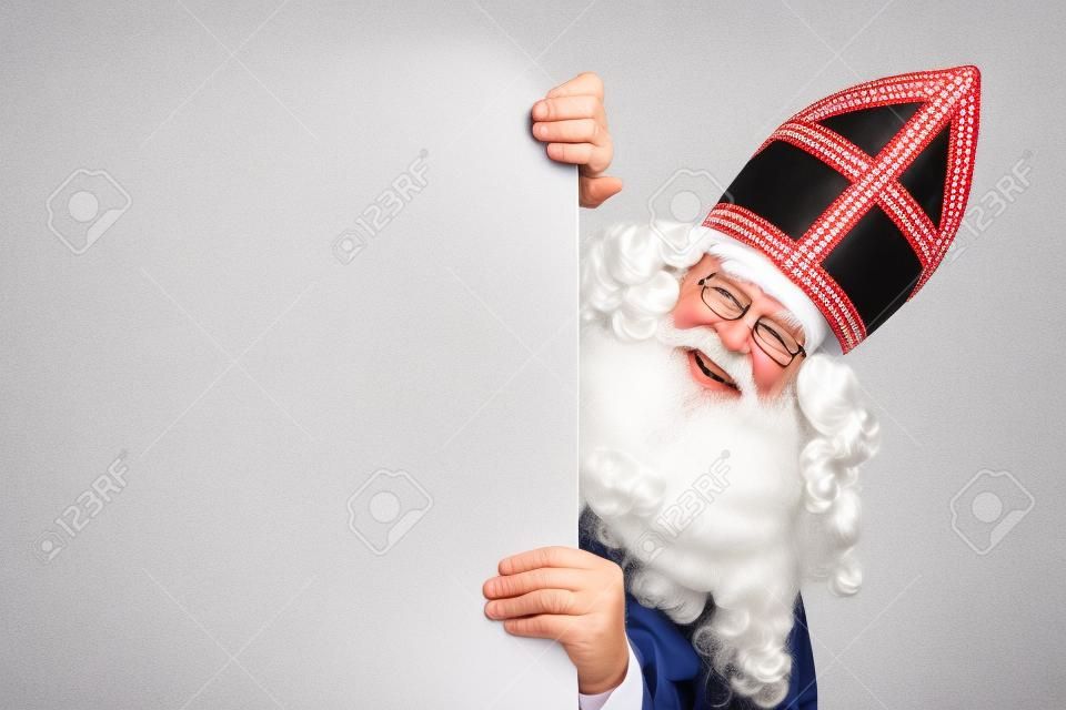 微笑Sinterklaas與白板。被隔絕在白色背景。聖誕老人的性格荷蘭