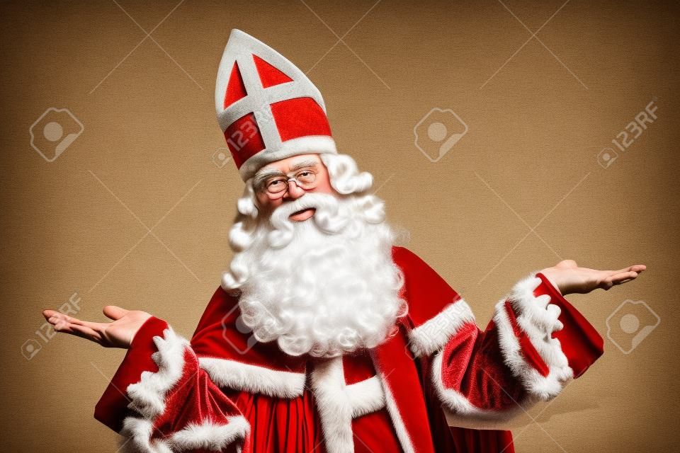 Sinterklaas portrait arms wide. isolated on white background with vintage look. Dutch character of Santa Claus