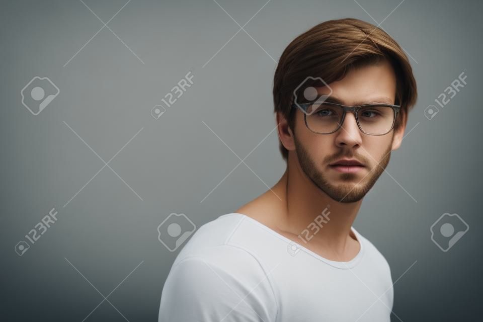 close up portrait of young handsome fair-haired guy avoiding danger
