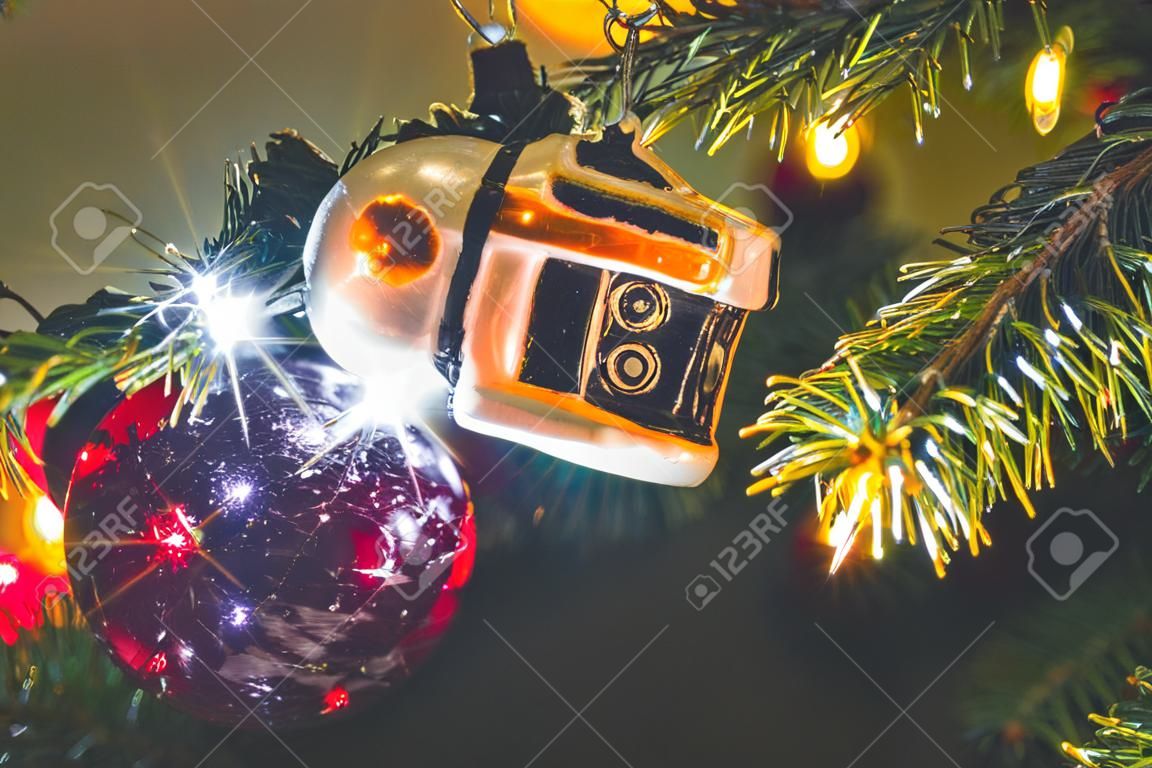 Christmas bauble on a Christmas tree and glowing lights